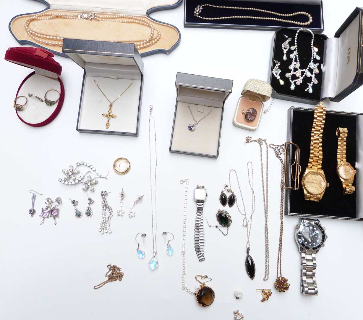 A collection of costume jewellery including silver earrings, silver chains and pendants, silver