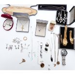 A collection of costume jewellery including silver earrings, silver chains and pendants, silver