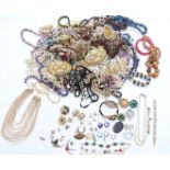 A collection of costume jewellery including silver earrings set with opals, silver brooch, white