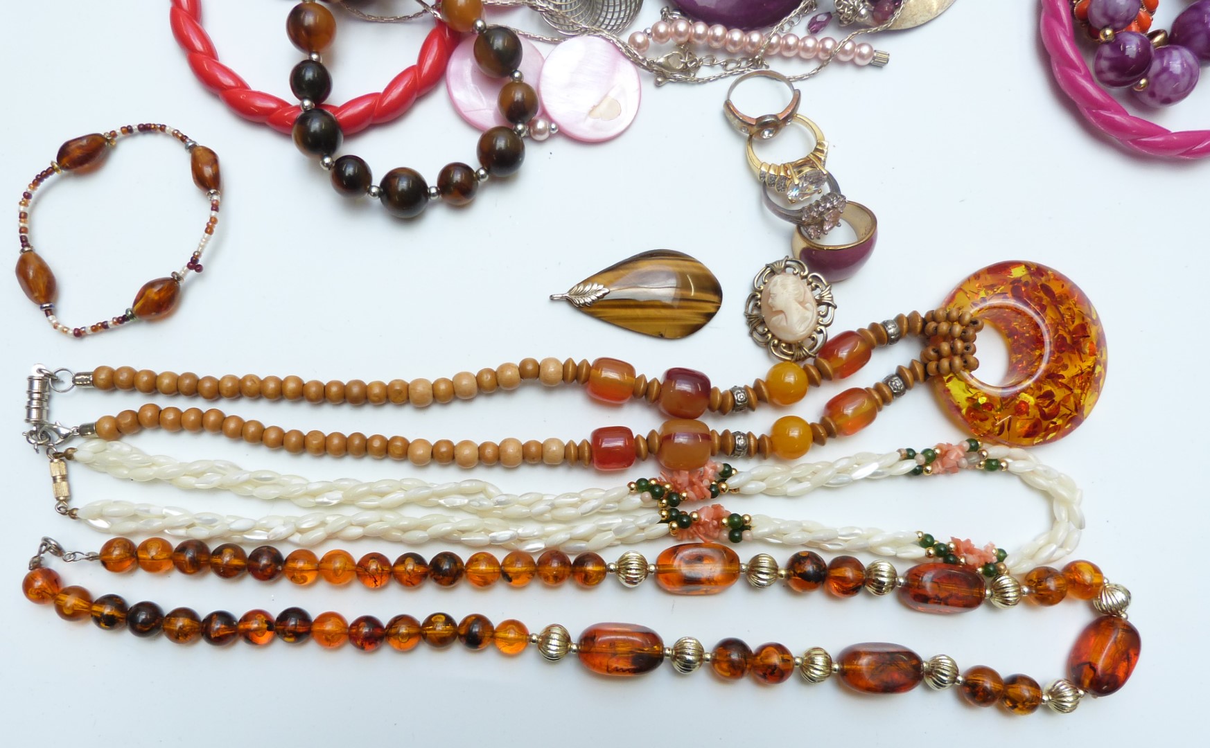 A collection of costume jewellery including beads, mother of pearl necklace, tiger's eye pendant, - Image 2 of 2