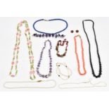 Necklaces including amethyst, pearl, sodalite and quartz, peridot and pearl examples and pearl
