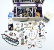 A collection of costume jewellery including two silver rings, brooches, silver brooch, silver