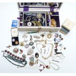 A collection of costume jewellery including two silver rings, brooches, silver brooch, silver