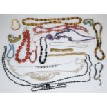 A collection of necklaces and bracelets including sponge coral, French jet, amethyst, diamanté,