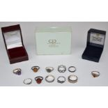 Eleven silver rings including amethyst and amber set