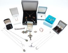A collection of silver jewellery including pressed amber necklace and earrings, pendants, Mexican