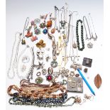 A collection of costume jewellery including Exquisite brooch, other brooches, necklaces, watches,