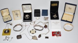 A collection of silver jewellery including brooches, ring, two Palestine bracelets, Wedgwood brooch,