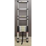 A telescopic portable aluminium ladder, height when collapsed 82cm