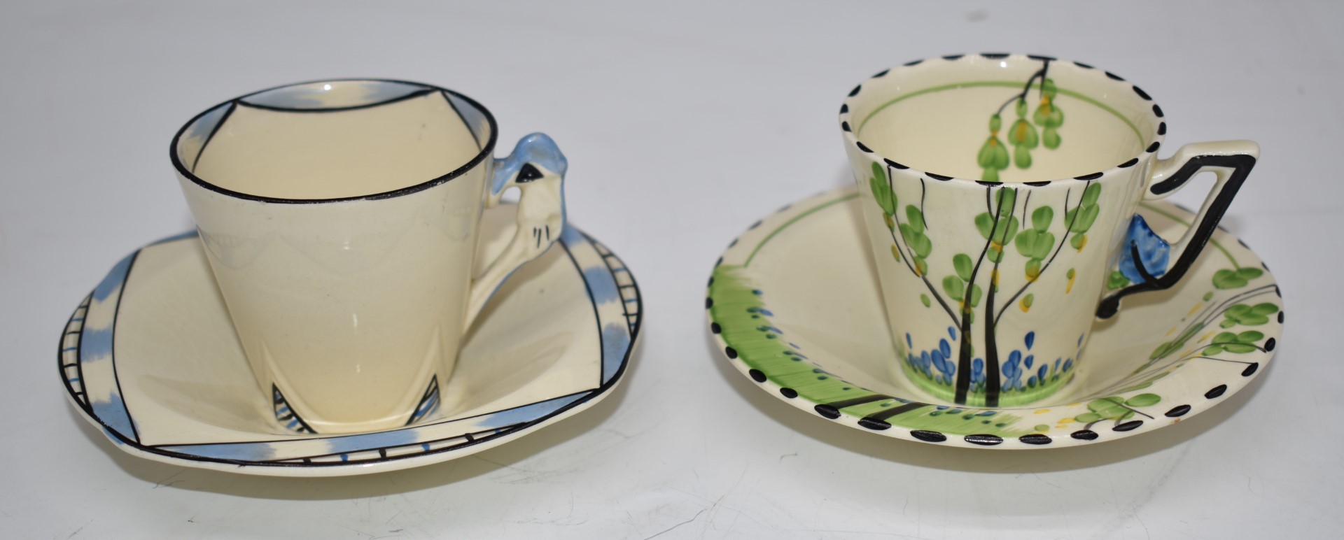 Two Burleigh Art Deco coffee cups and saucers, one also marked Zenith, diameter 12cm