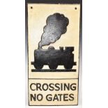 Cast iron 'crossing no gates' road sign, with steam locomotive above, 58 x 29cm