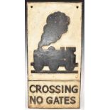 Cast iron 'crossing no gates' road sign, with steam locomotive above, 58 x 29cm