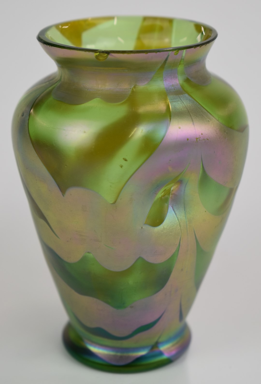 Loetz or similar dimpled iridescent glass vase, 11.5cm tall.