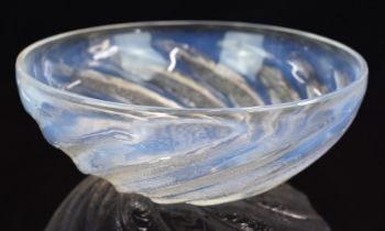 Lalique Poissons opalescent glass bowl decorated with spiralling fish, stamped 'R Lalique', 24cm