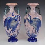 Enoch Wood pair of twin handled pedestal vases decorated with herons, H31cm