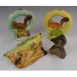 Two Burleigh Ware squirrel flower frogs, budgie wall pocket and a Poole pottery bird, tallest 20cm