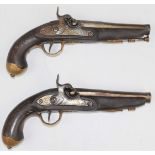 A pair of Eastern percussion converted from flintlock hammer action pistols, each with engraved lock