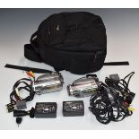Four Panasonic VDR-D310 video camcorders, in two backpacks with instructions, chargers,