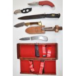 Six various knives including a Solingen example with serrated 13cm blade and sheath, Virginia with
