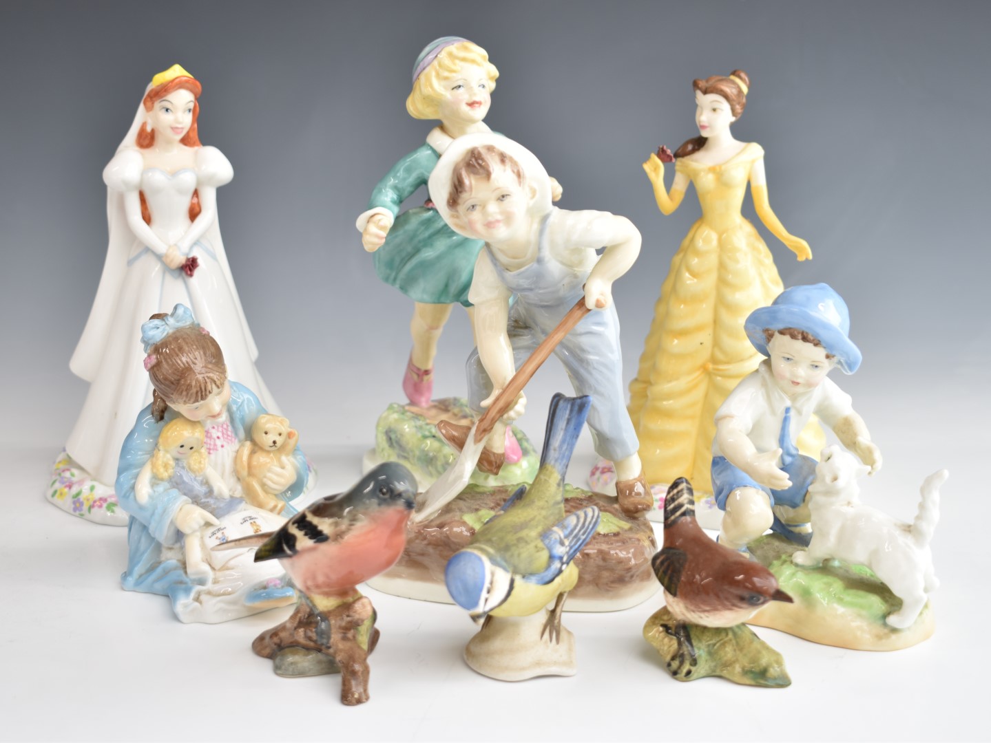 Royal Worcester, Doulton and Beswick figures including Disney princesses Ariel and Belle, tallest