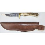 A bespoke hand-made sheath knife with deer horn handle by Stuart Mitchell, impressed 'Monarch