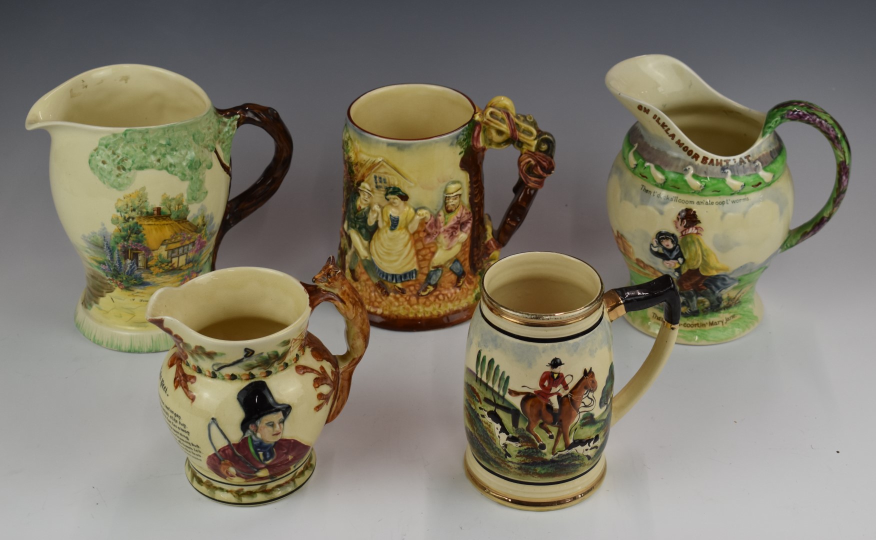 Five musical jugs including Crown Devon, Sylvac and Royal Winton, tallest 19cm