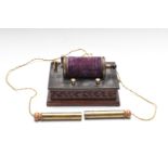 Electric shock therapy machine, on carved wooden base, length 20cm