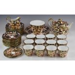 Approximately forty three pieces of Royal Crown Derby Imari teaware, decorated in the 2451