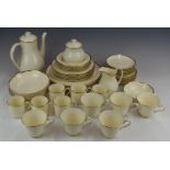 Approximately sixty pieces of Royal Doulton dinner and teaware decorated in the Heather pattern,