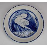 Llanelly Pottery plate with crimped rim and standing stork decoration, diameter 25cm