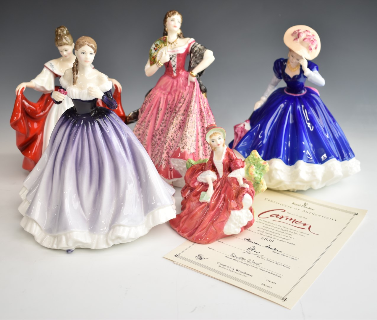 Five Royal Doulton figurines including Carmen with certificate, Mary and Megan, tallest 26cm