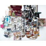 A collection of costume jewellery including earrings, Art Deco Empire bracelet, watches, etc