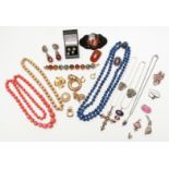 A collection of costume jewellery including Hollywood brooch, Trifari necklace, silver pendant, etc