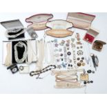 A collection of costume jewellery including rings, vintage brooches, faux pearls, fresh water