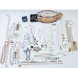 A collection of jewellery including silver charm bracelet, pearl necklace, silver pendants, Monet