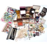 A collection of costume jewellery including silver bangle, vintage brooches, beads, jet brooch,
