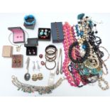 A collection of jewellery including bangles, two silver mounted items, beads, abalone necklace,
