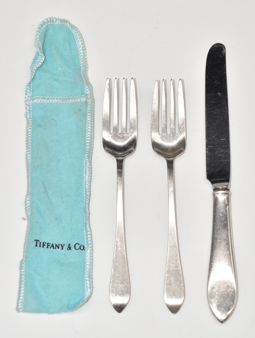 Two Tiffany & Co. sterling silver forks, length 15.5cm, and similar knife, weight of forks 72g, in