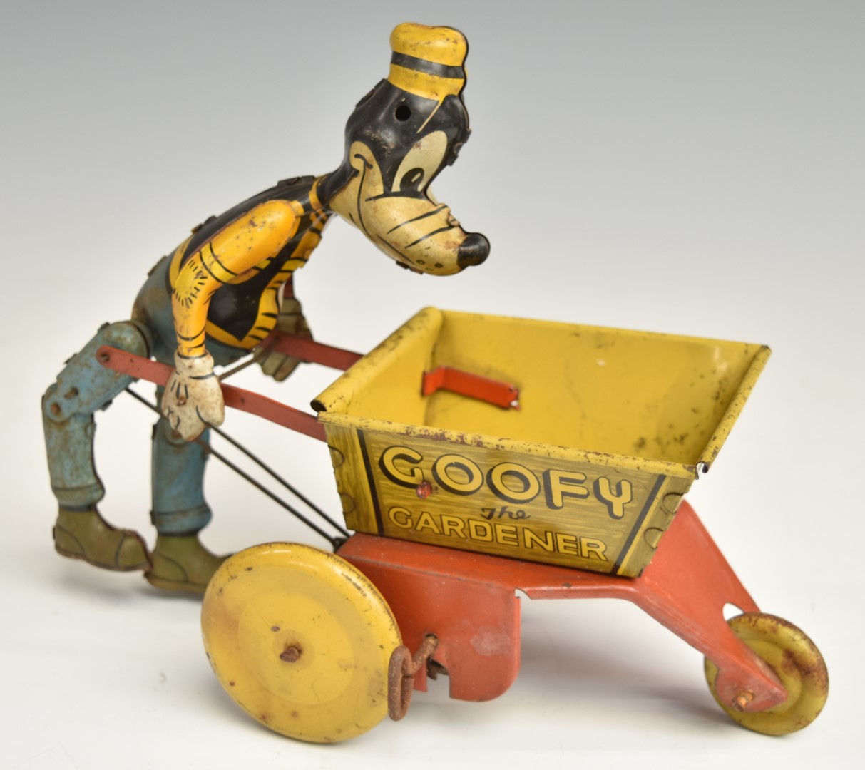 Louis Marx clockwork tinplate Goofy The Gardener, 17.5cm tall.