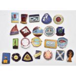 A collection of Butlins holiday camp badges for Filey, Brighton, Margate, Blackpool and Ayr from