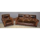 Upholstered leather sofa and matching chair, length of sofa 188cm