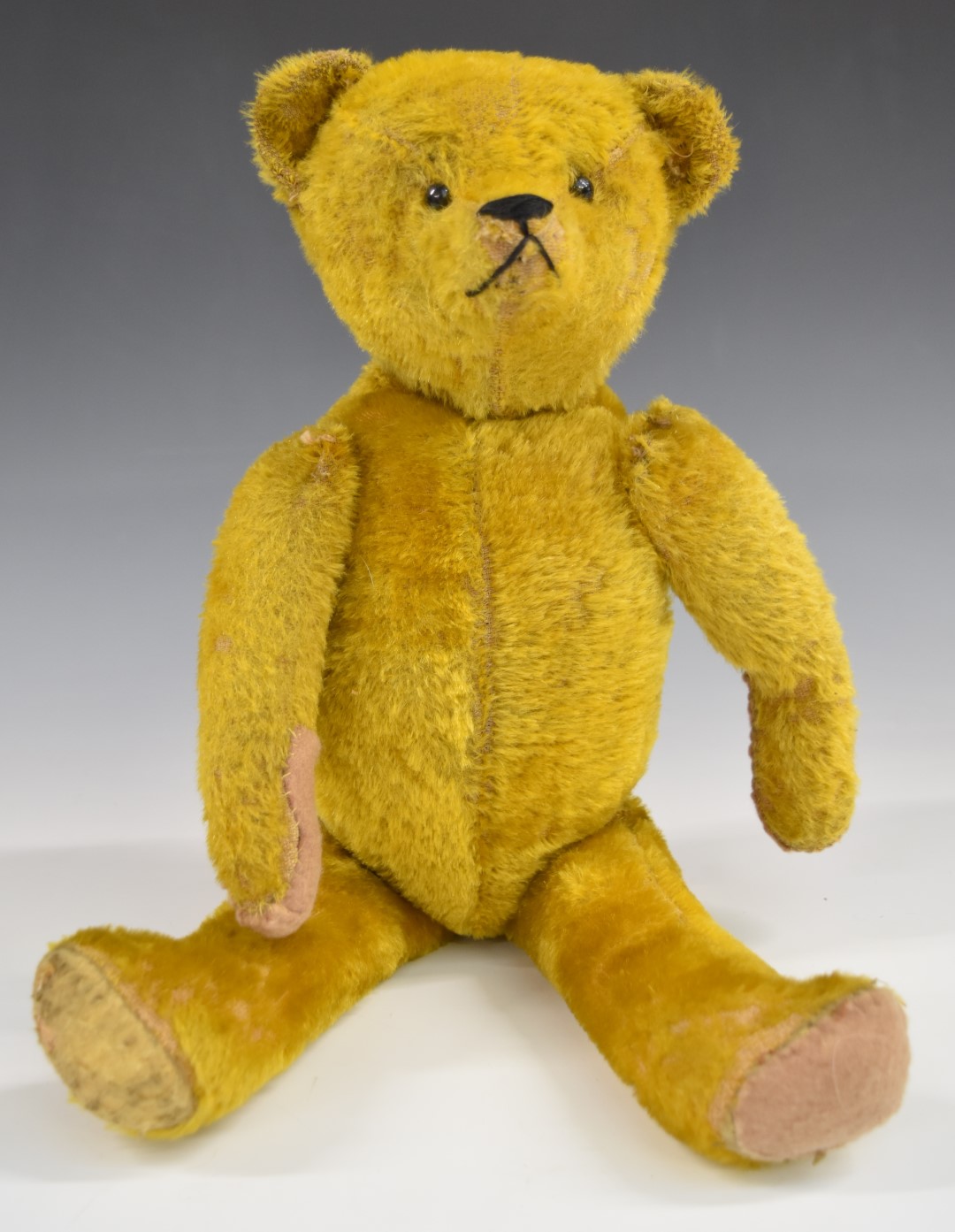 American Teddy bear with golden mohair, straw filling, disc joints, felt pads and stitched features,