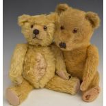 Two English Teddy bears one with blonde mohair, shaved snout, soft filling, disc joints, felt pads