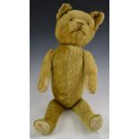 American Teddy bear with blonde mohair, straw filling, disc joints, felt pads and stitched features,