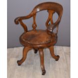 Early 20thC leather upholstered oak swivel office chair, H87cm