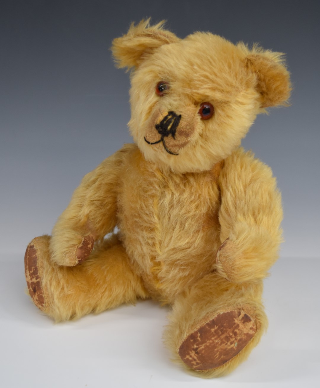 Farnell Teddy bear with growler, golden mohair, soft filling, disc joints, cloth pads and stitched