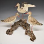 Two carved bird groups on driftwood bases, height of taller 40cm