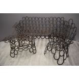 Garden furniture suite made from horseshoes comprising sofa, chair and table