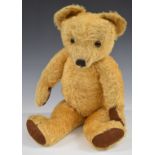 Merrythought Teddy bear with squeaker, golden mohair, soft filling, disc joints, felt pads and