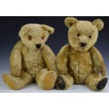 Two Chad Valley, Merrythought or similar Teddy bears one with golden mohair, leather pads, disc